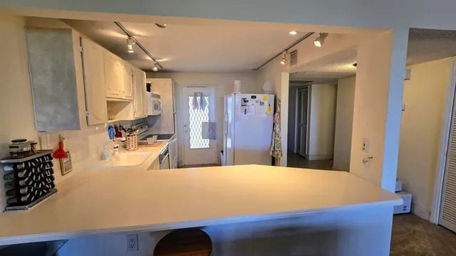 a room with a bed and a large mirror