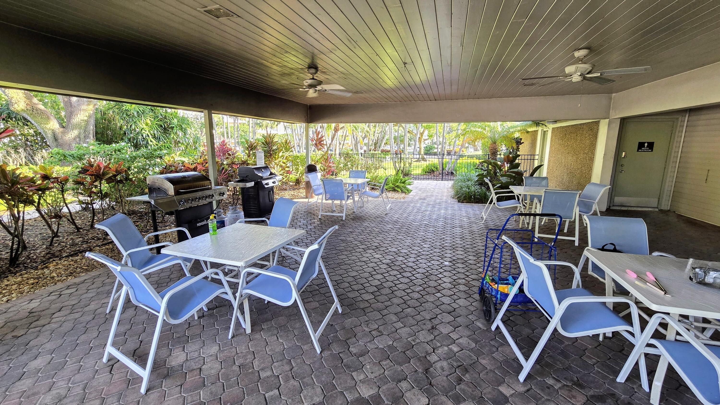 3100 North Course Lane, Unit 410 Pompano Beach, FL 33069 - Photo 23 of 23 a view of a dining room with furniture window and outside view
