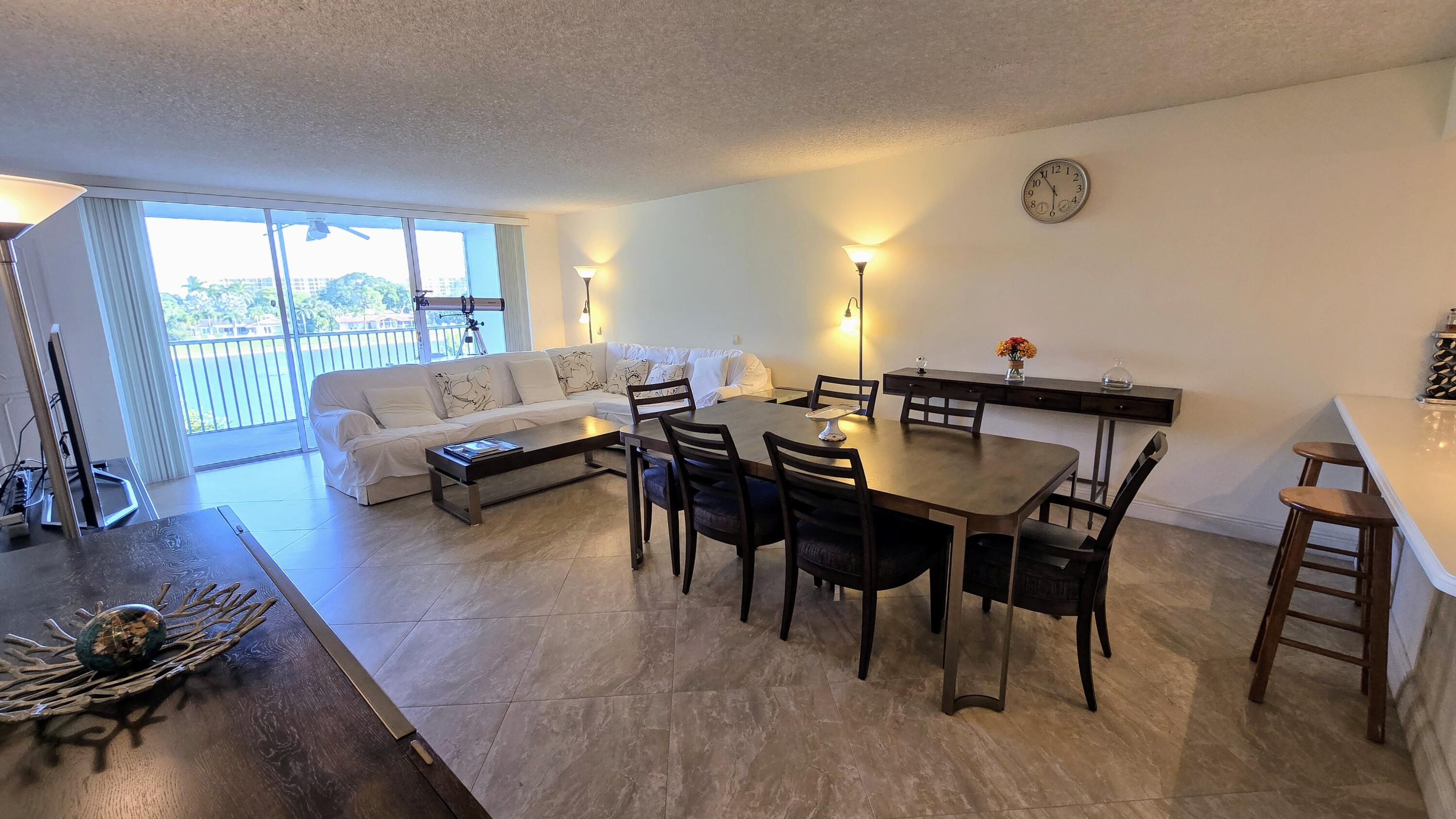 3100 North Course Lane, Unit 410 Pompano Beach, FL 33069 - Photo 8 of 23 a living room with furniture and wooden floor