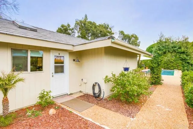 17355 Avenida De Acacias Rancho Santa Fe, CA 92067 - Photo 15 of 16 a front view of a house with garden