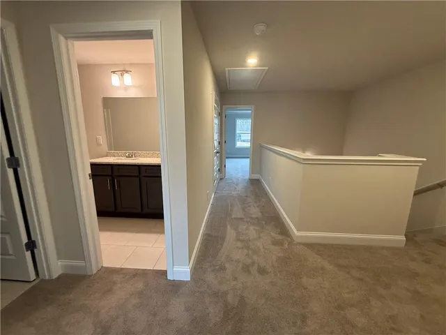 a view of room with a ceiling fan and window