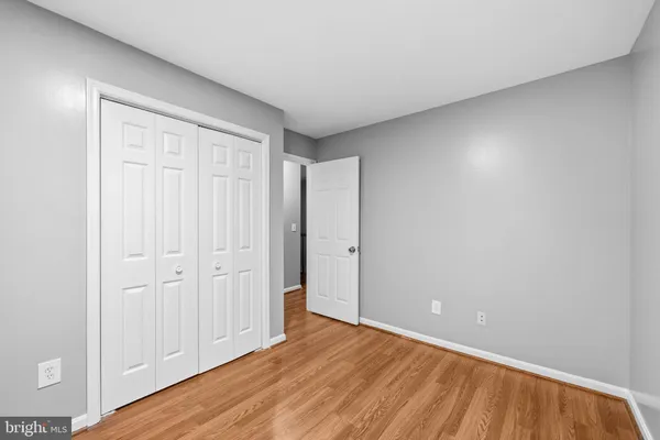 a view of an empty room and wooden floor