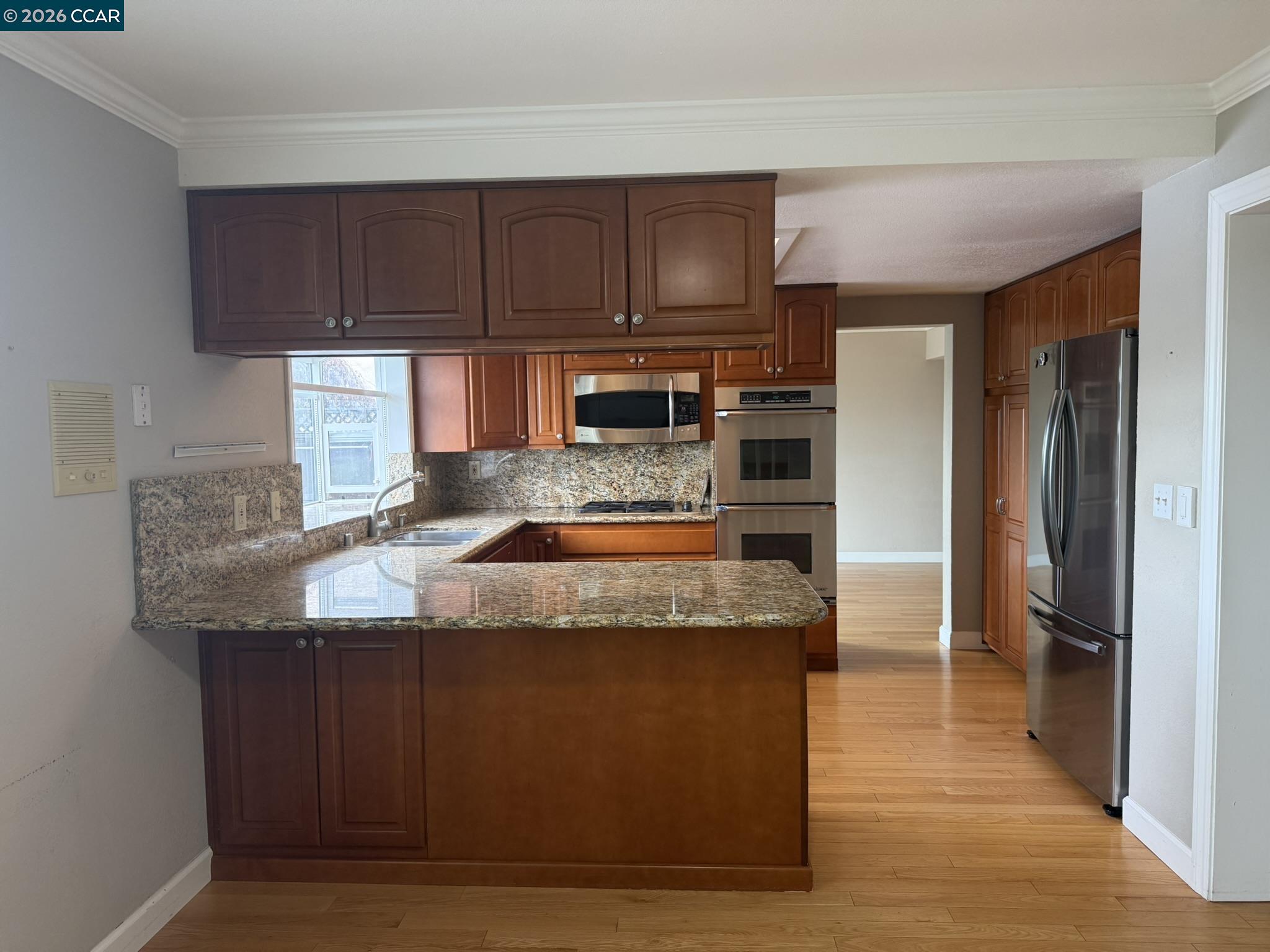 1109 Vista Point Lane Concord, CA 94521 - Photo 13 of 26 a view of a kitchen counter space and wooden floor