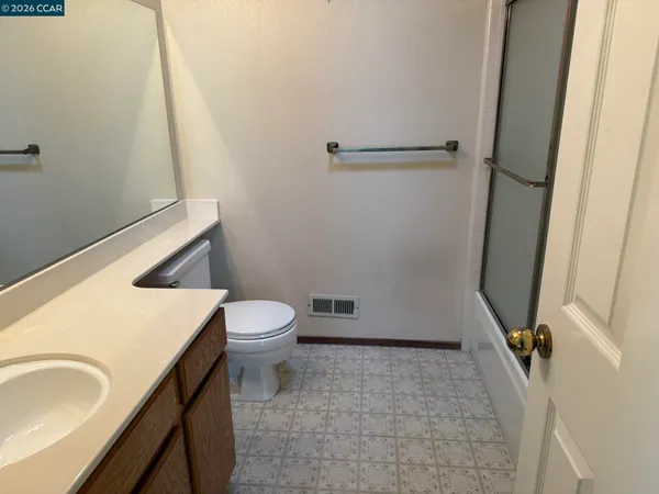 a bathroom with a sink and toilet