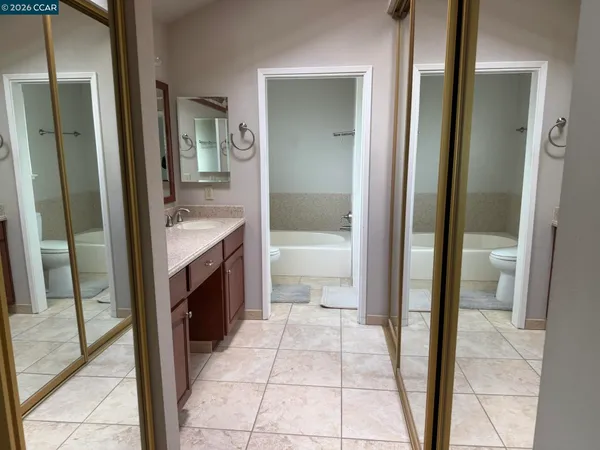 a bathroom with a tub and shower