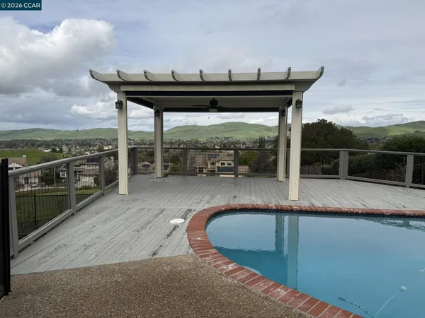 a view of a swimming pool with a lounge chair