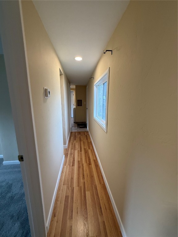 847 Airport Road, Unit 4 Breckenridge, CO 80424 - Photo 16 of 32 a view of a hallway with wooden floor and staircase