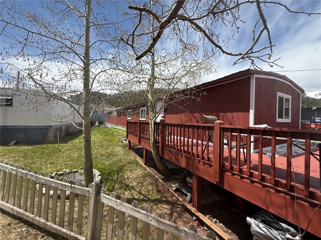 847 Airport Road, Unit 4 Breckenridge, CO 80424 - Photo 24 of 32 a view of a yard with wooden fence