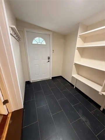 a view of an empty walk in closet