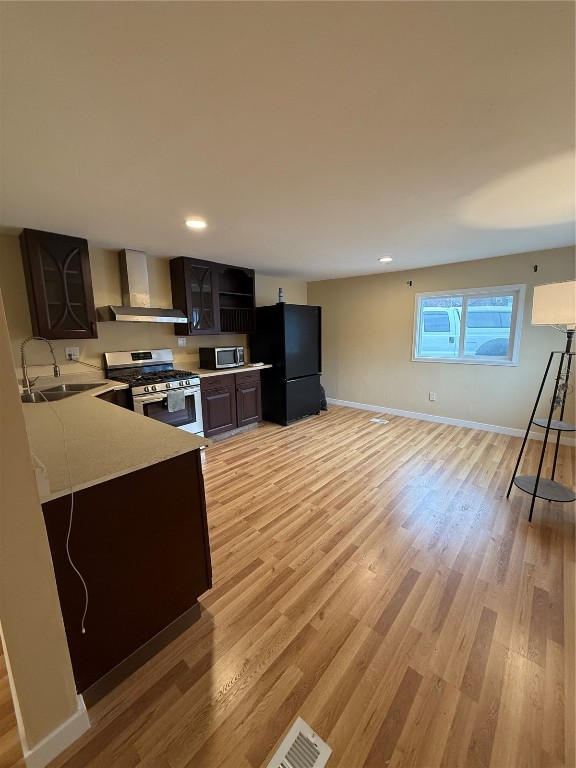 847 Airport Road, Unit 4 Breckenridge, CO 80424 - Photo 3 of 32 a kitchen with stainless steel appliances a stove top oven a sink and a microwave