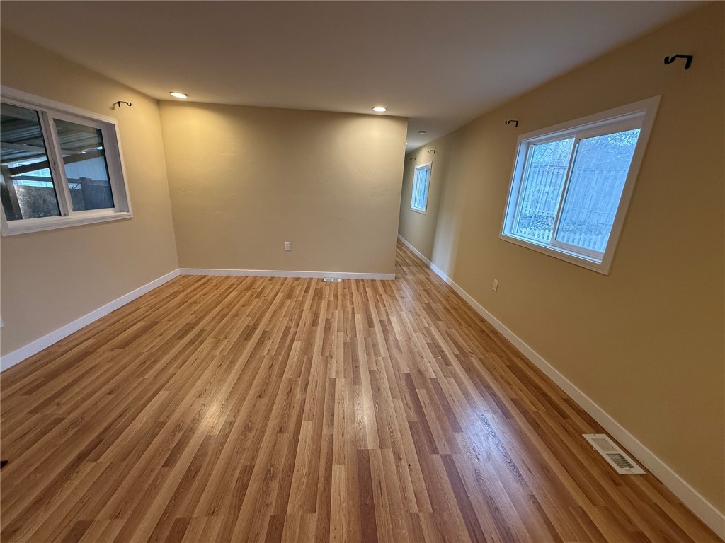 847 Airport Road, Unit 4 Breckenridge, CO 80424 - Photo 9 of 32 a view of an empty room with wooden floor and a window