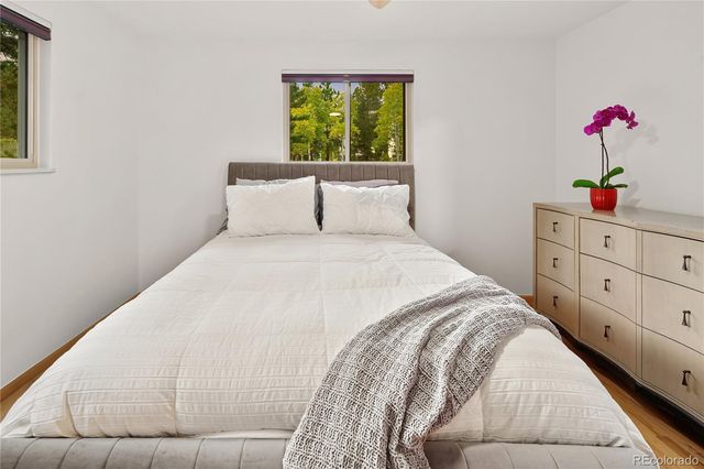 a bathroom with a toilet and a mirror