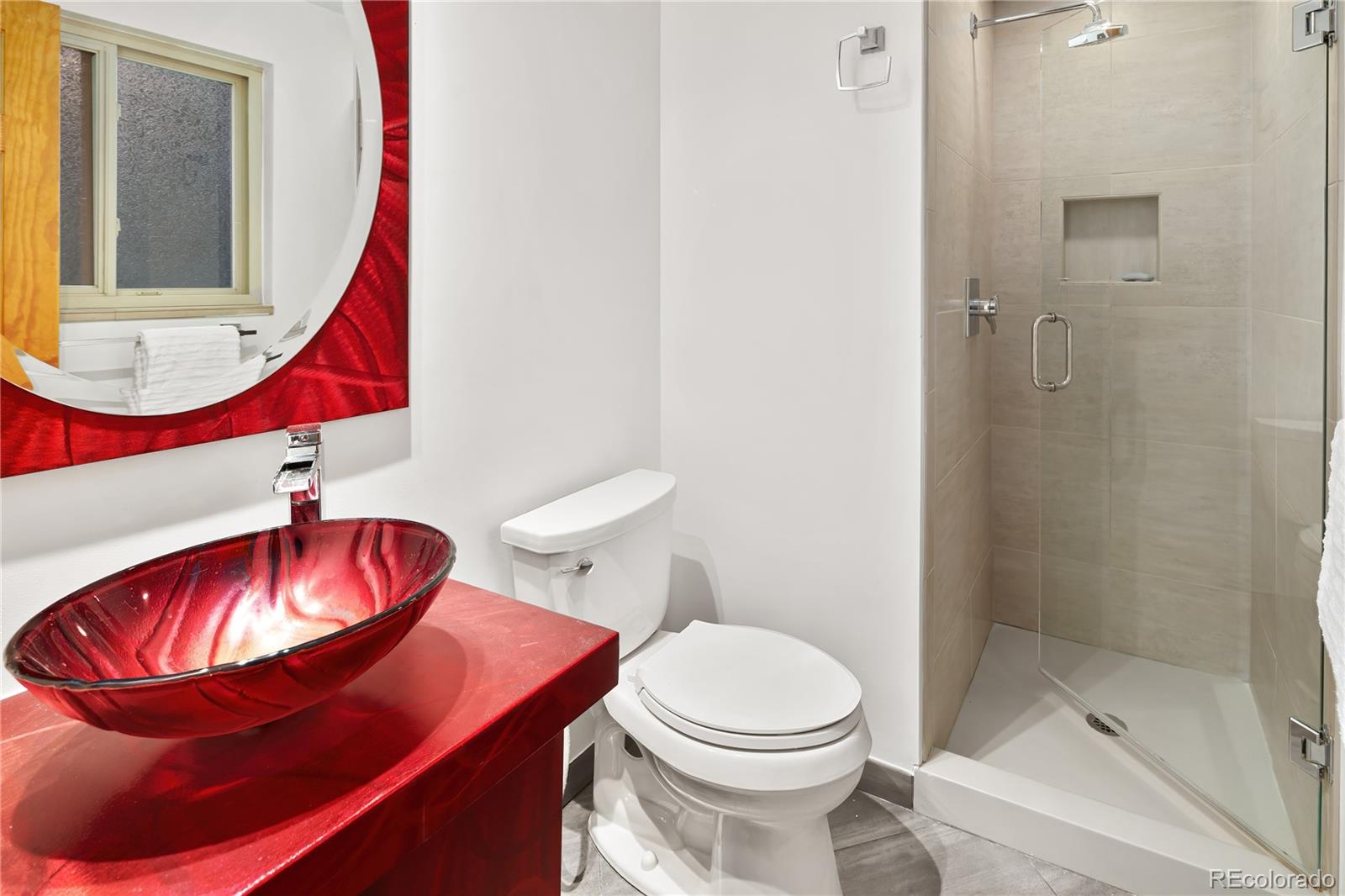 28696 Little Big Horn Drive Evergreen, CO 80439 - Photo 23 of 47 a bathroom with a toilet and a mirror