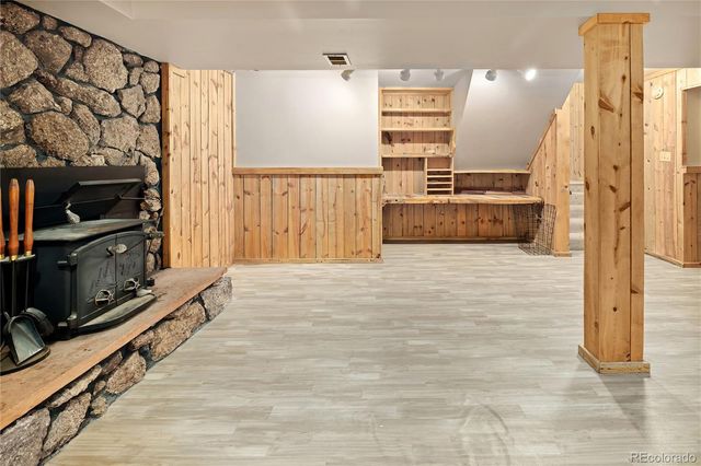 a view of hallway with wooden floor