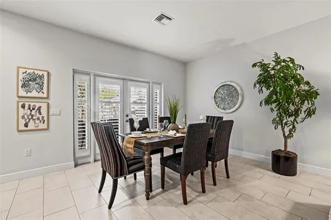 a kitchen with stainless steel appliances granite countertop a sink counter space cabinets and a large window