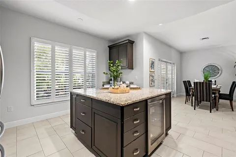 a kitchen with granite countertop stainless steel appliances and wooden cabinets
