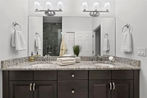 a bathroom with a shower and a sink