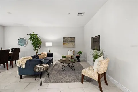 a kitchen with stainless steel appliances kitchen island granite countertop a stove refrigerator and sink