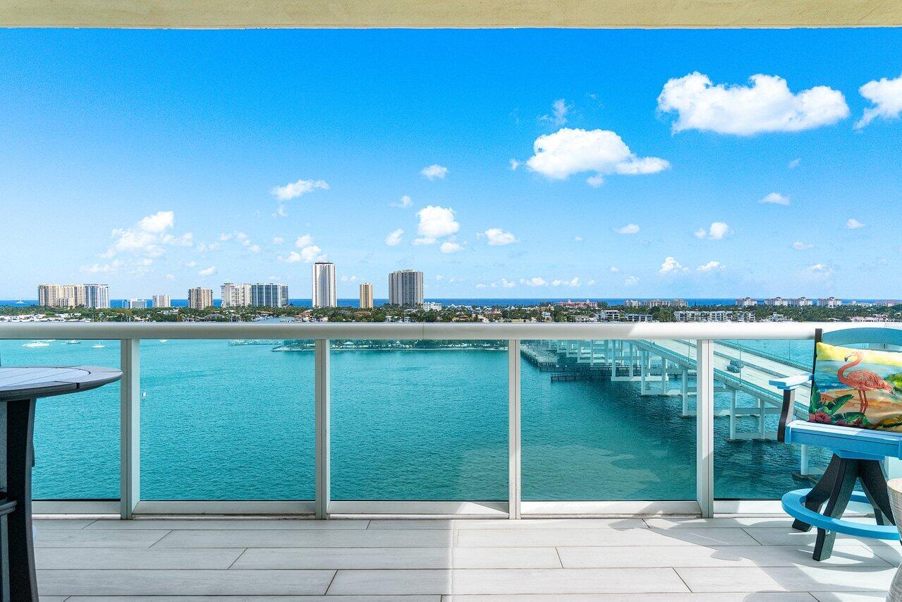 2640 Lake Shore Drive, Unit 1216 Riviera Beach, FL 33404 - Photo 2 of 60 a view of a lake with a sitting space