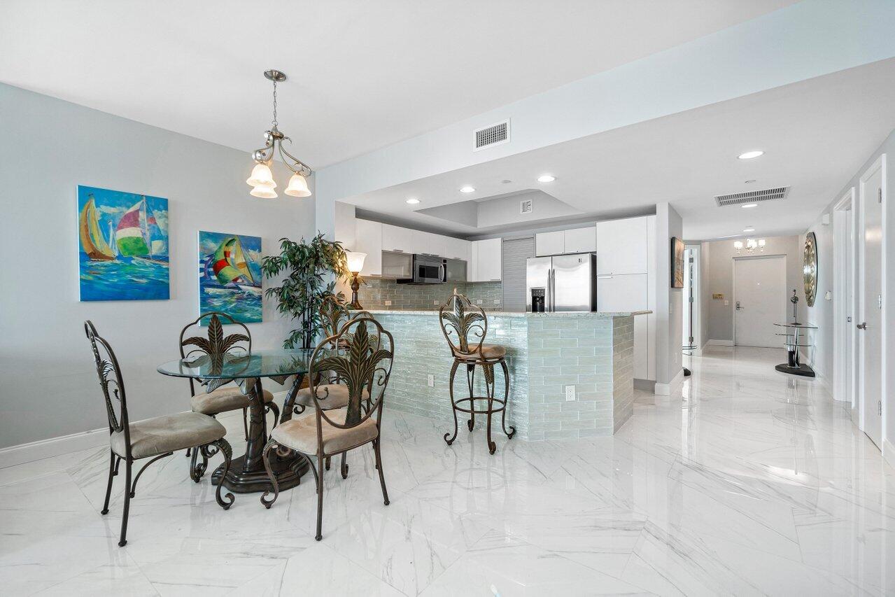2640 Lake Shore Drive, Unit 1216 Riviera Beach, FL 33404 - Photo 10 of 60 a view of a dining area with furniture