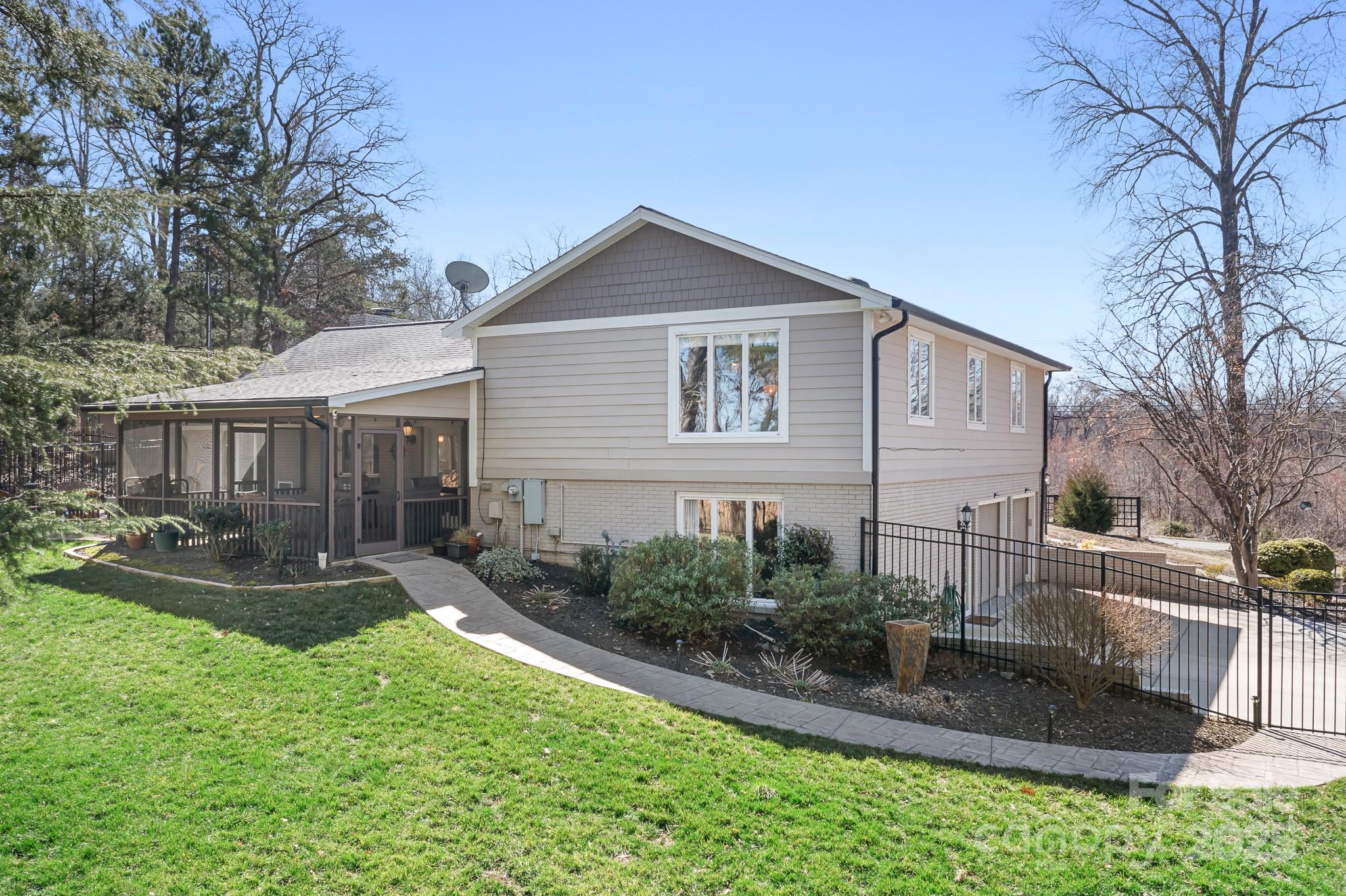 19320 Davidson-Concord Road Davidson, NC 28036 - Photo 1 of 33 a front view of a house with a yard