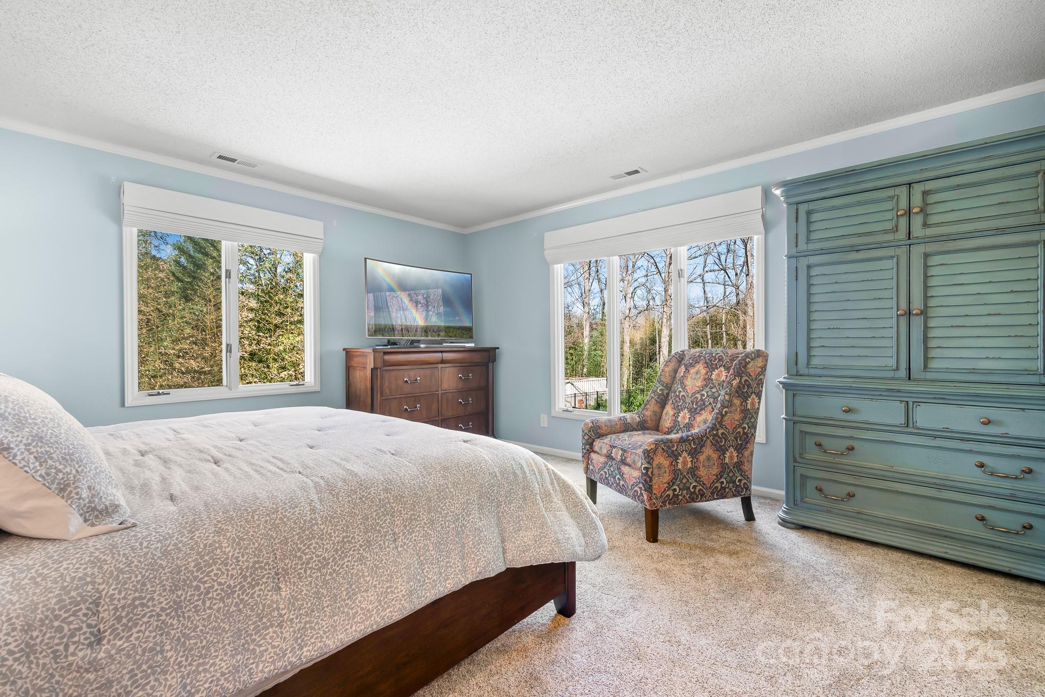19320 Davidson-Concord Road Davidson, NC 28036 - Photo 12 of 33 a bedroom with a bed and wooden floor