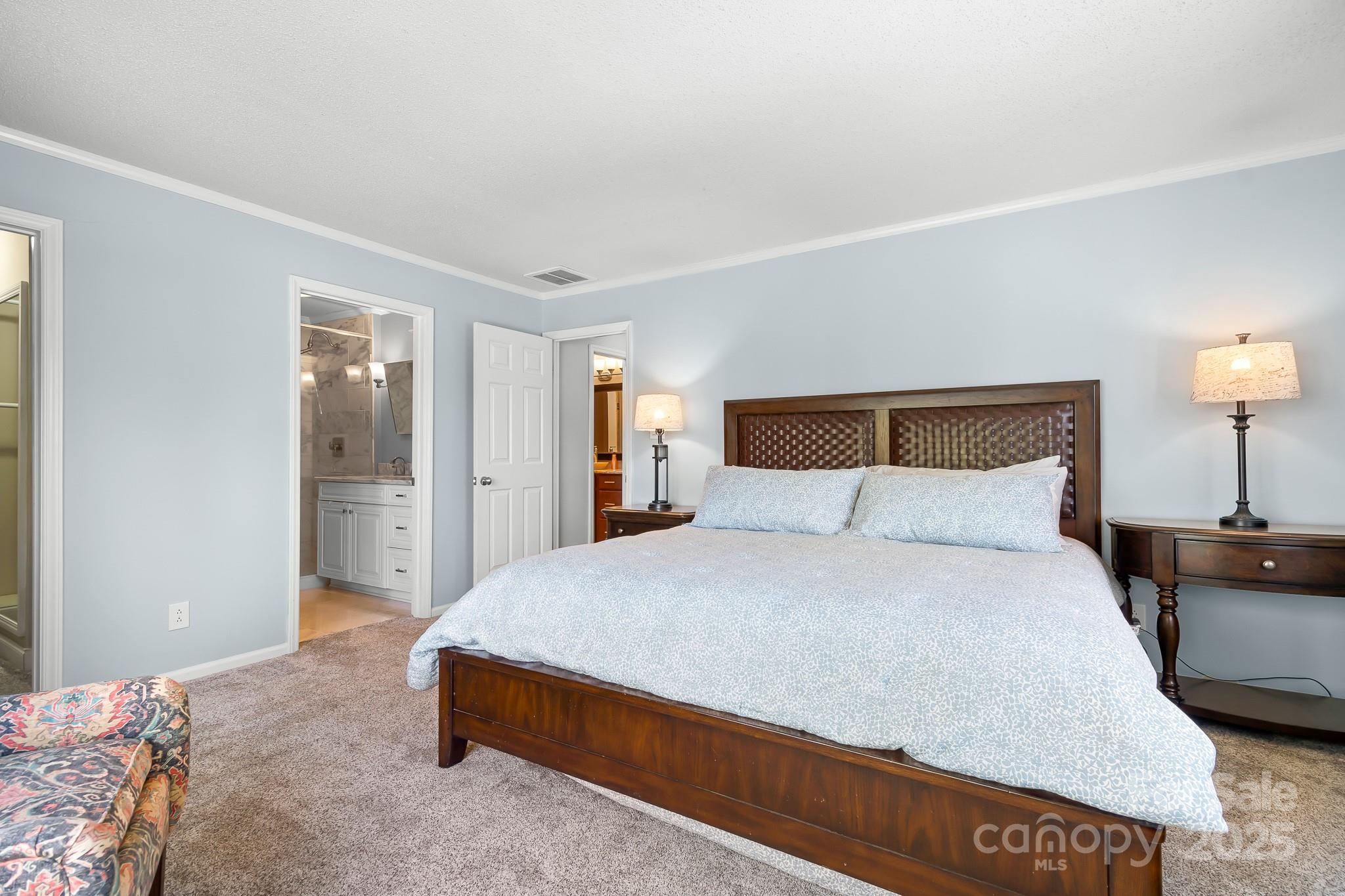 19320 Davidson-Concord Road Davidson, NC 28036 - Photo 13 of 33 a bedroom with a bed and a night stand