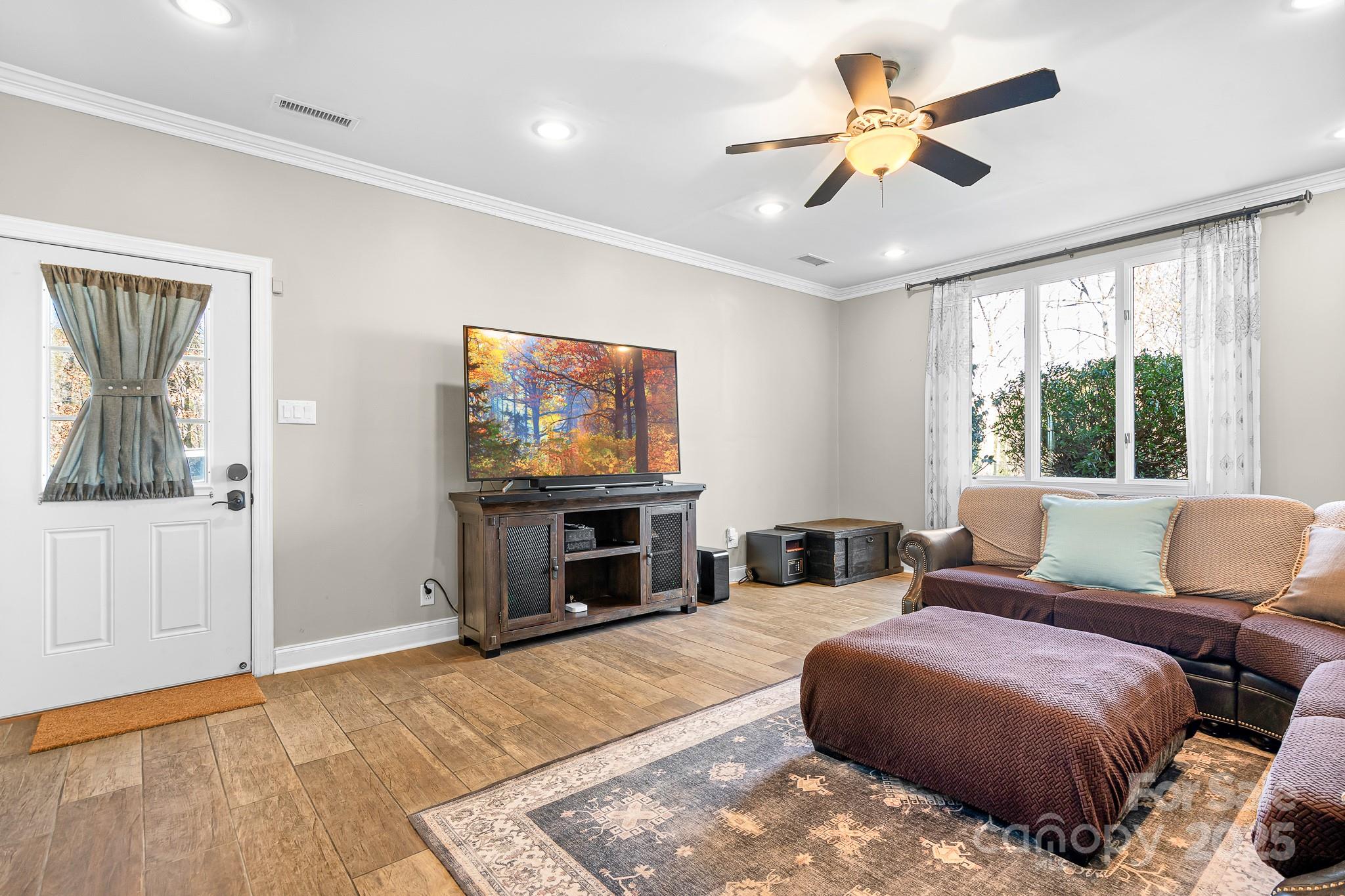 19320 Davidson-Concord Road Davidson, NC 28036 - Photo 20 of 33 a bedroom with a bed and a flat screen tv