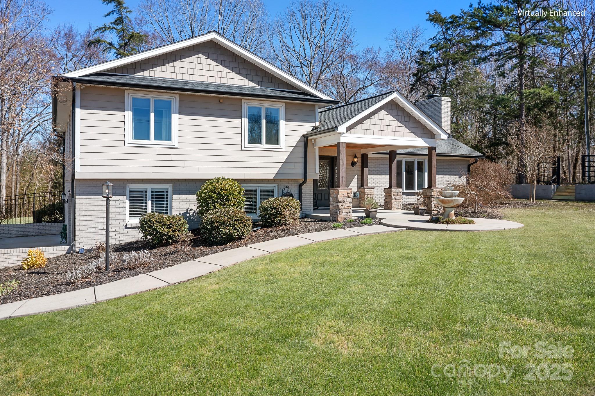 19320 Davidson-Concord Road Davidson, NC 28036 - Photo 24 of 33 a front view of a house with a yard outdoor seating and garage