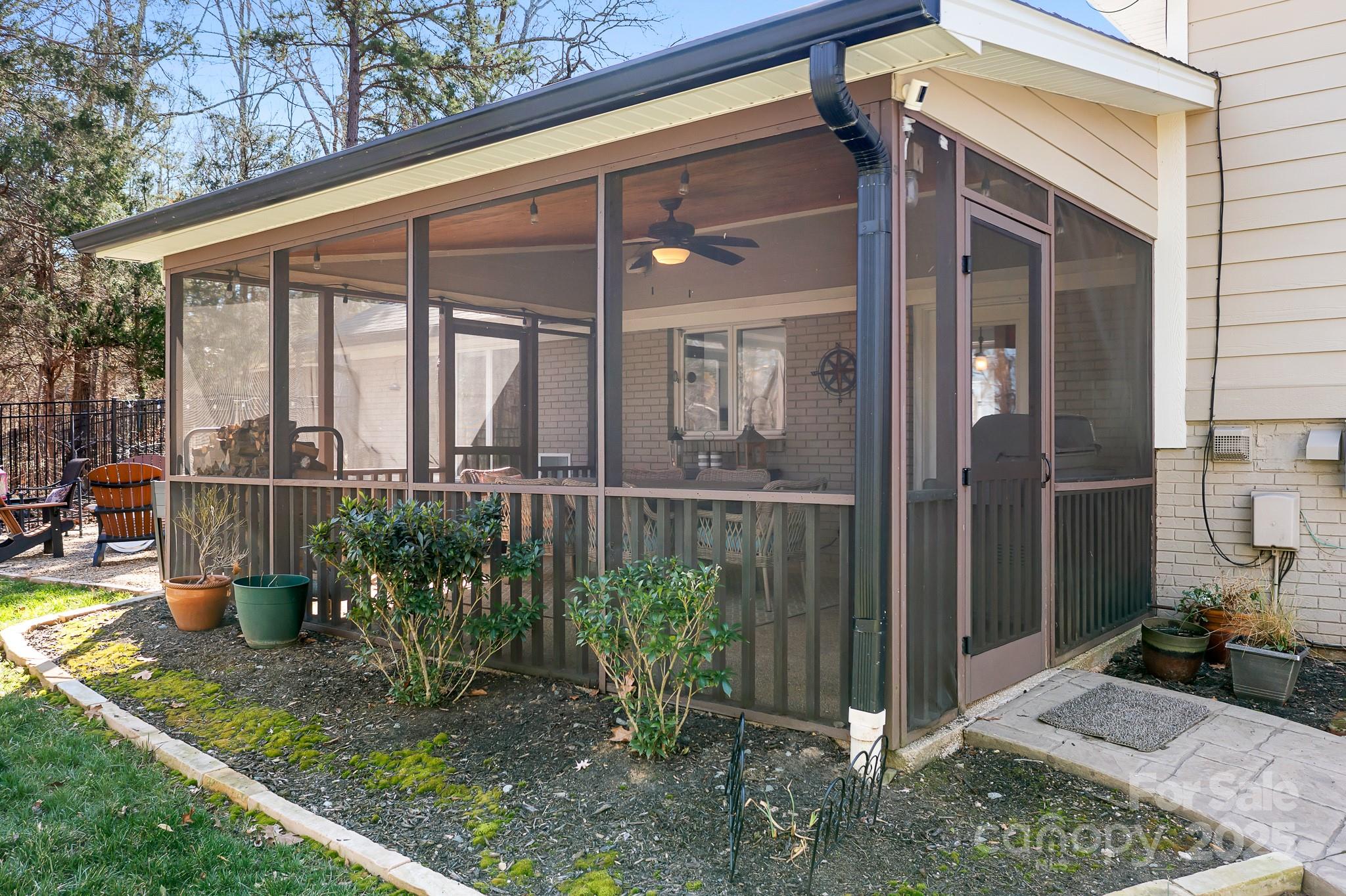 19320 Davidson-Concord Road Davidson, NC 28036 - Photo 26 of 33 a view of a chair and table in backyard of the house