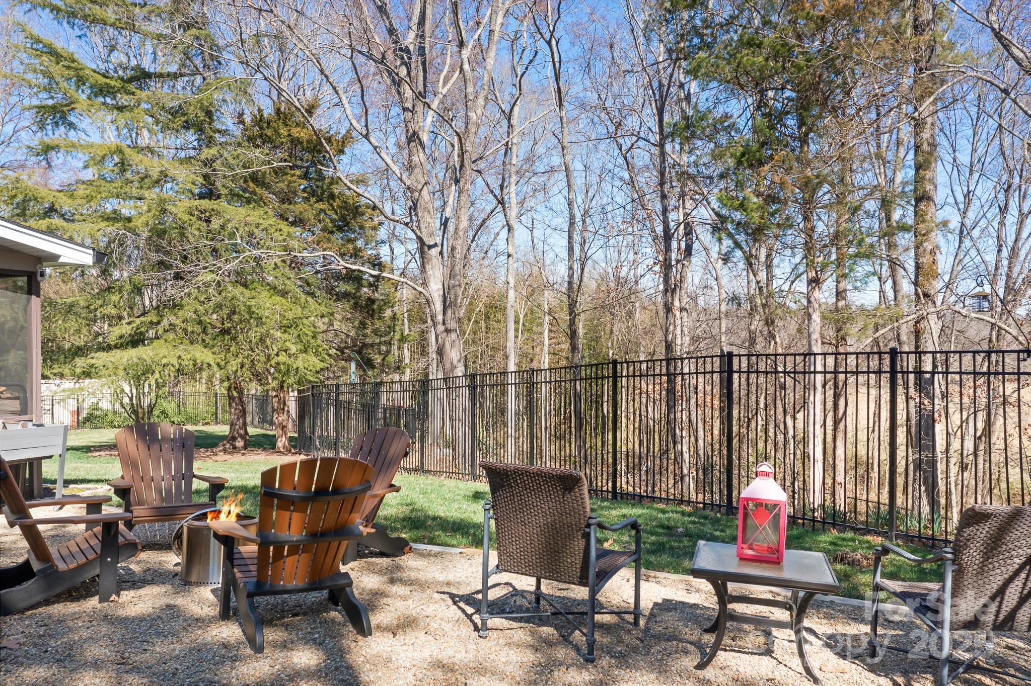 19320 Davidson-Concord Road Davidson, NC 28036 - Photo 27 of 33 a backyard of a house with table and chairs