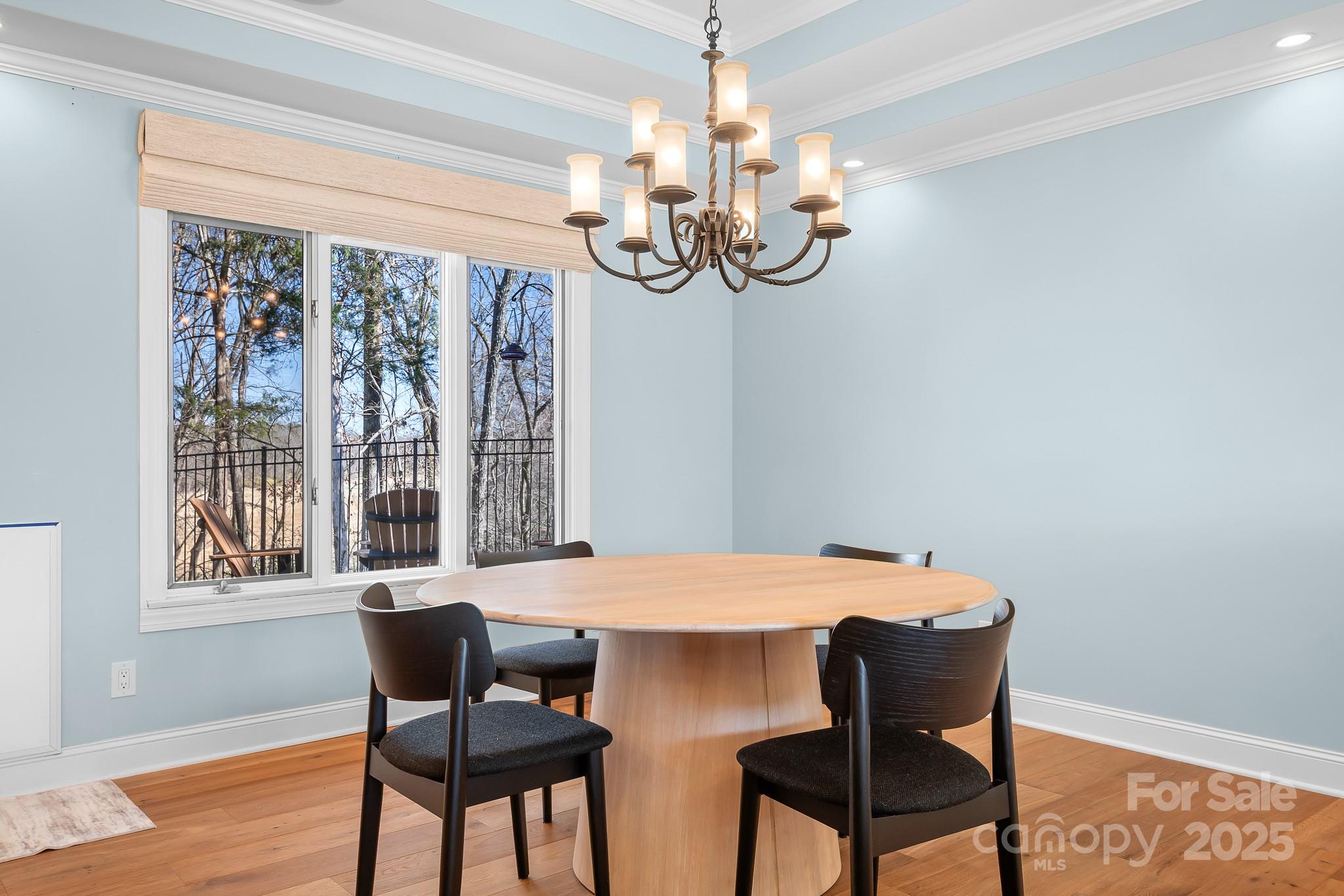 19320 Davidson-Concord Road Davidson, NC 28036 - Photo 5 of 33 a view of a dining room with furniture wooden floor and chandelier