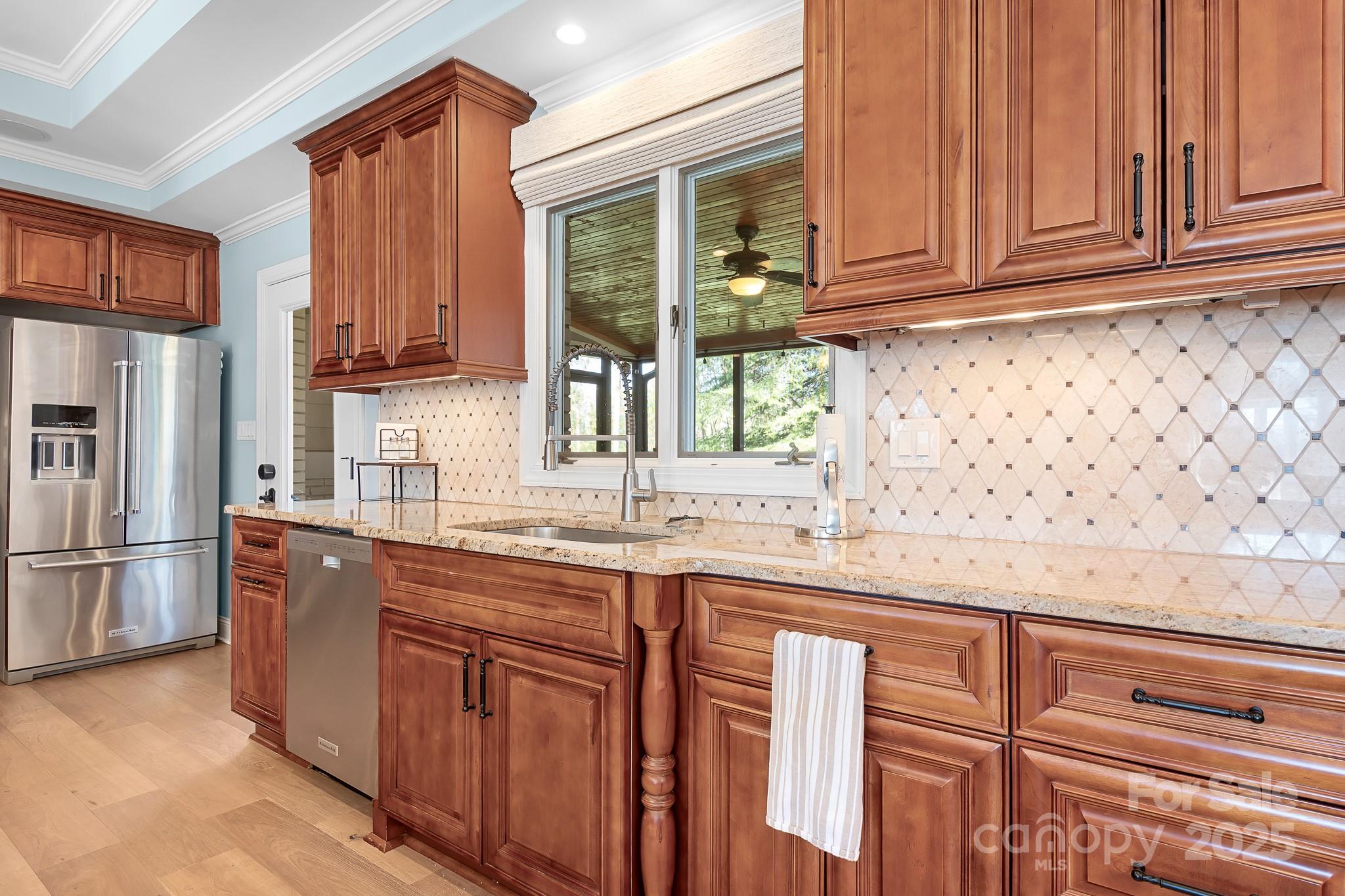 19320 Davidson-Concord Road Davidson, NC 28036 - Photo 8 of 33 a kitchen with stainless steel appliances granite countertop a refrigerator and a sink