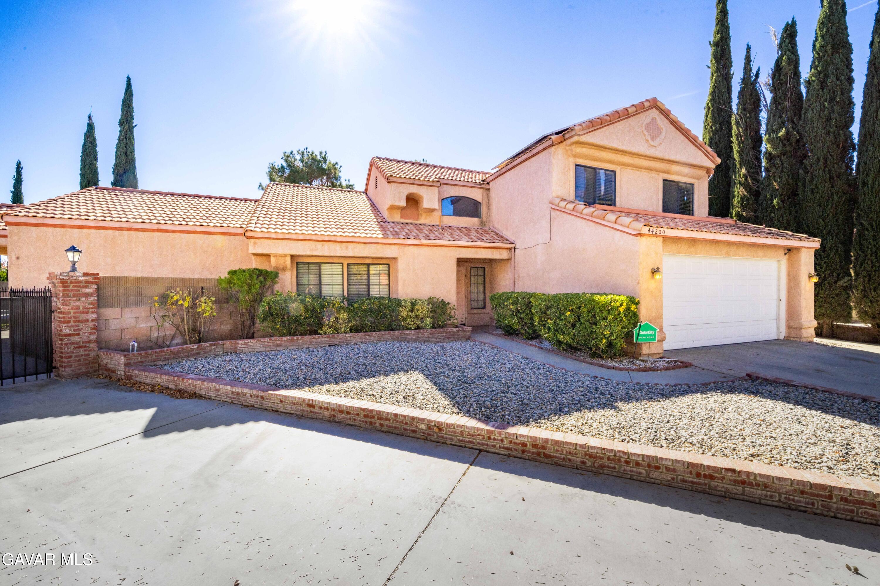 44200 Galion Avenue Lancaster, CA 93536 - Photo 2 of 42 a front view of a house with a yard and garage