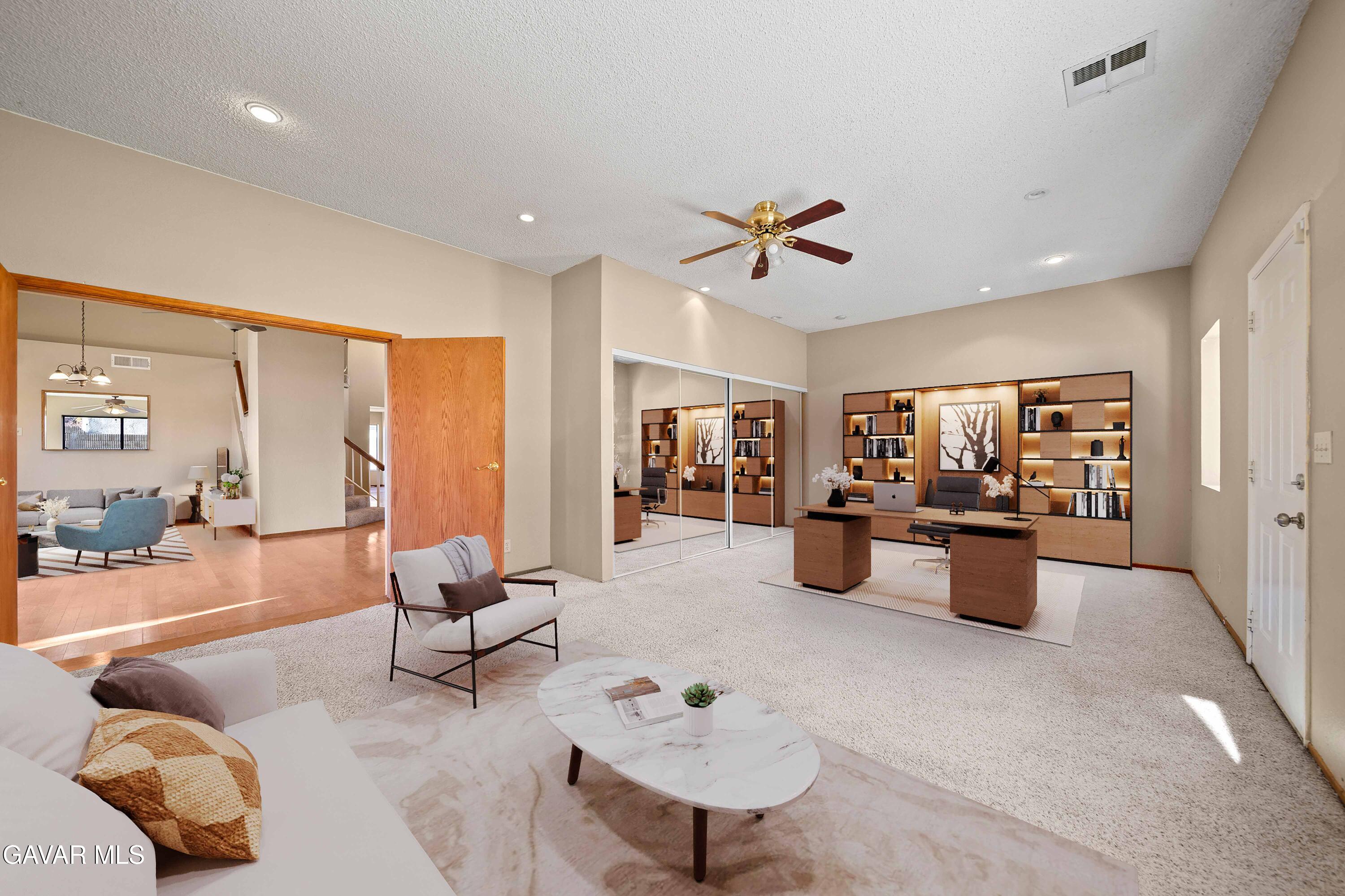 44200 Galion Avenue Lancaster, CA 93536 - Photo 22 of 42 a living room with furniture and a large window