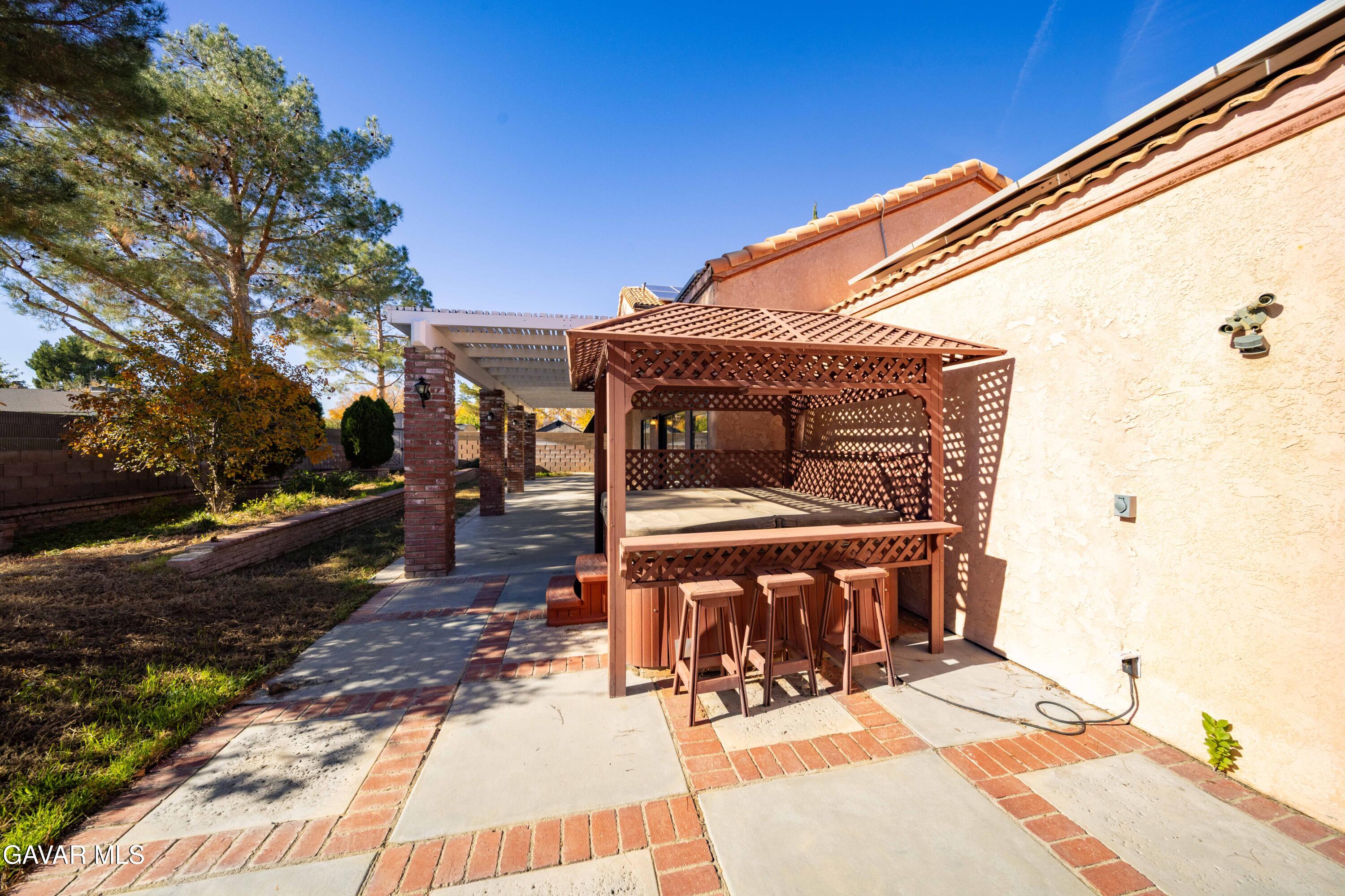 44200 Galion Avenue Lancaster, CA 93536 - Photo 32 of 42 a view of house with backyard porch and sitting area