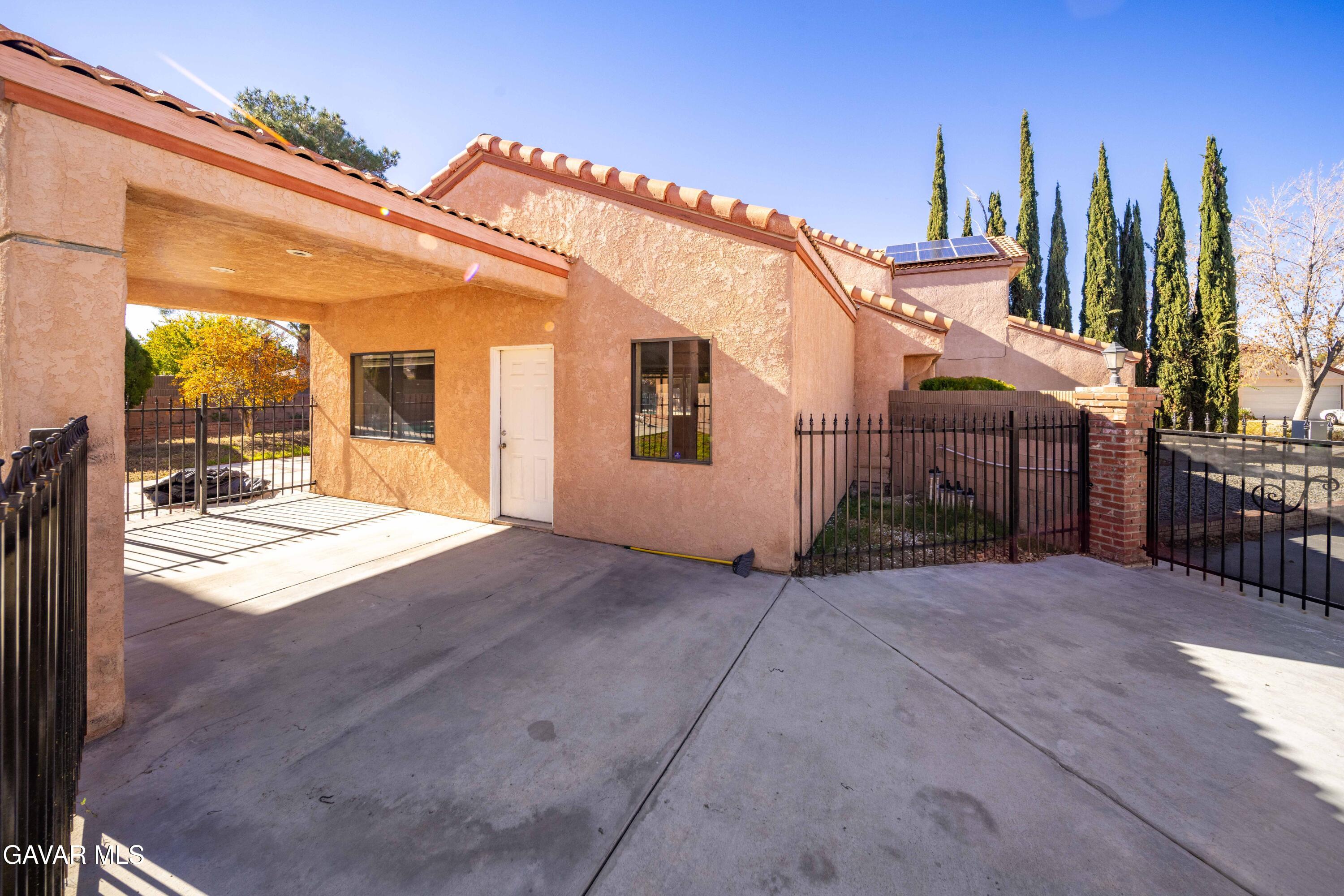 44200 Galion Avenue Lancaster, CA 93536 - Photo 33 of 42 a view of a house with backyard and roof