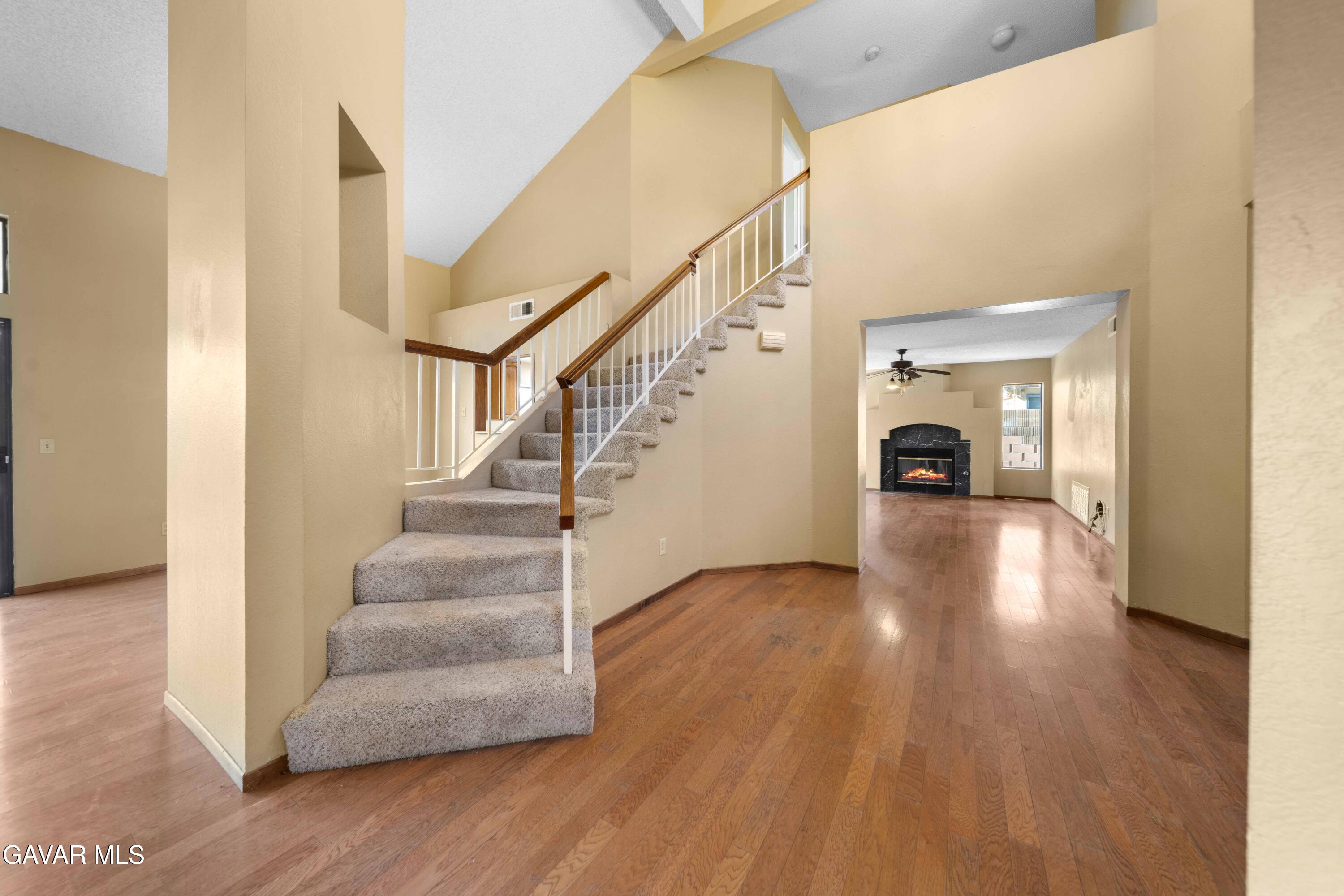 44200 Galion Avenue Lancaster, CA 93536 - Photo 6 of 42 a view of entryway and hall with wooden floor