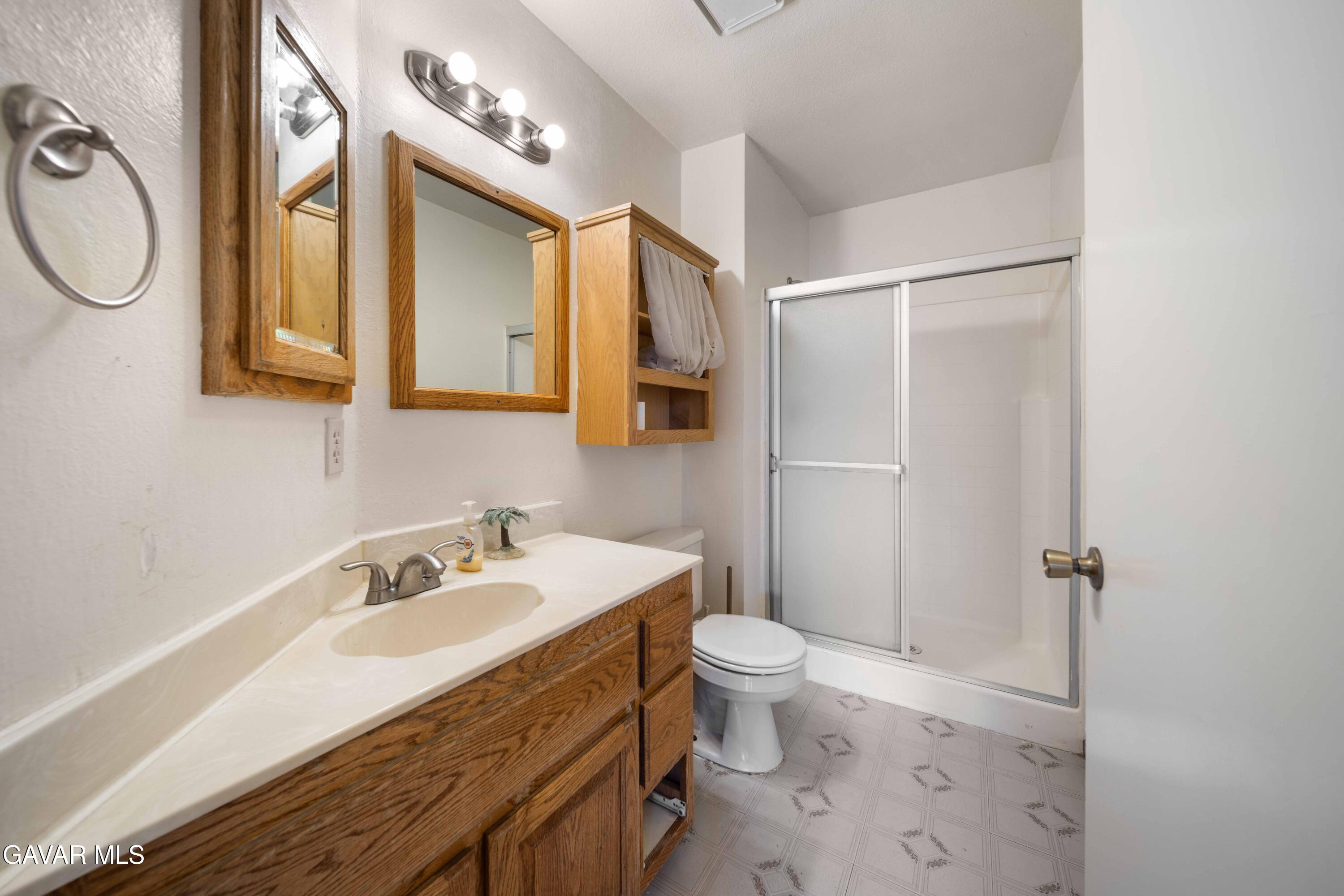 44200 Galion Avenue Lancaster, CA 93536 - Photo 7 of 42 a bathroom with a sink toilet and shower