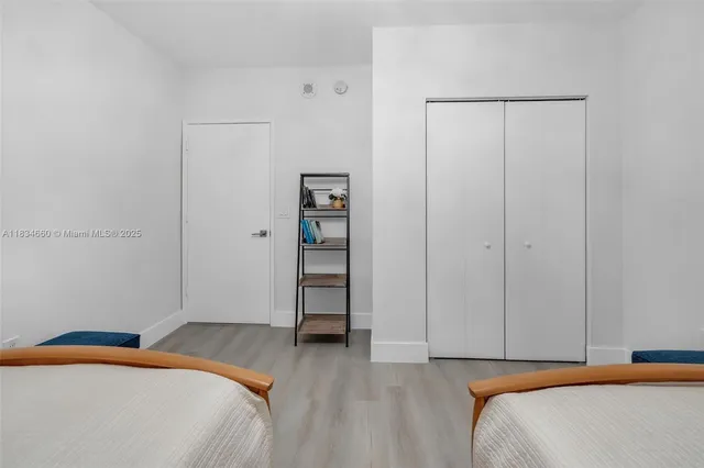 a bedroom with a bed and a closet