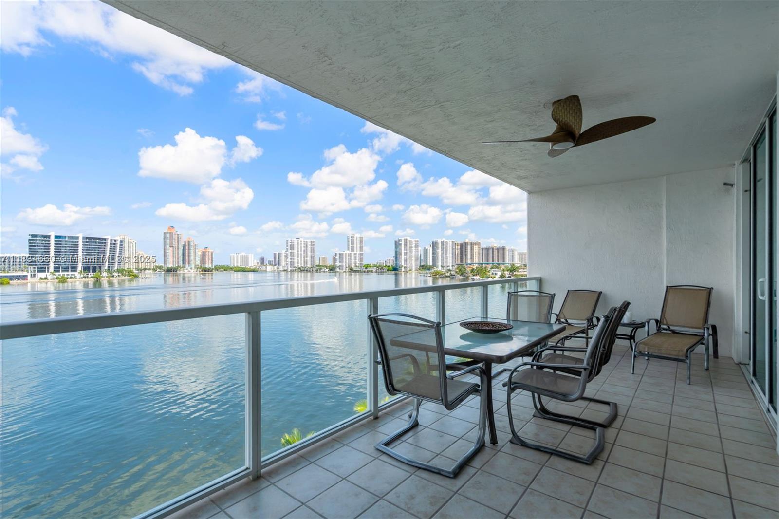 18100 North Bay Road, Unit 709 Sunny Isles Beach, FL 33160 - Photo 26 of 33 a view of a swimming pool with chair and table