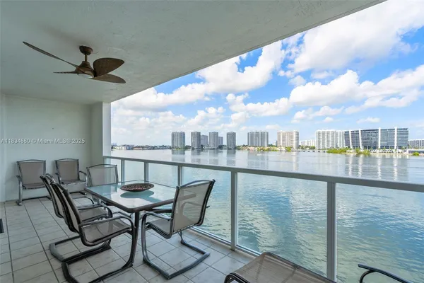 a view of a balcony with furniture