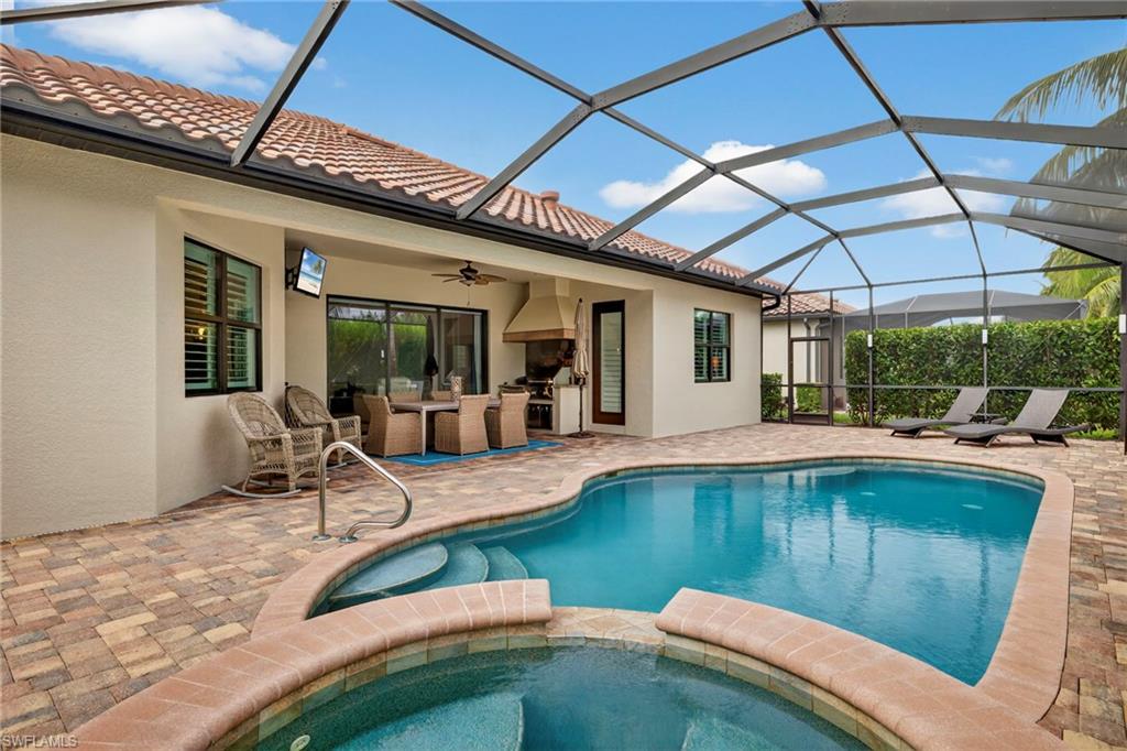 9352 Vercelli Court Naples, FL 34113 - Photo 35 of 49 a view of a swimming pool with a patio