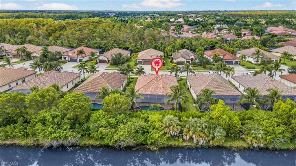 9352 Vercelli Court Naples, FL 34113 - Photo 44 of 49 a view of a street with a houses