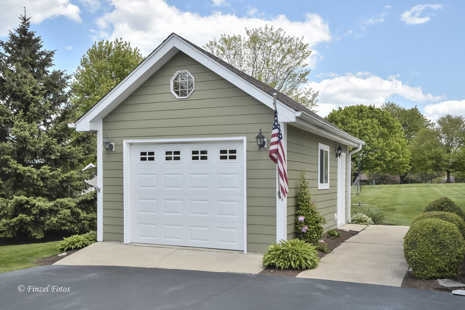 7N355 Ridge Line Road St. Charles, IL 60175 - Photo 23 of 38 a front view of a house with a yard and garage