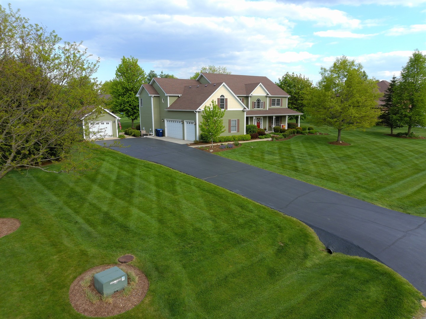 7N355 Ridge Line Road St. Charles, IL 60175 - Photo 25 of 38 a front view of a house with a yard and potted plants