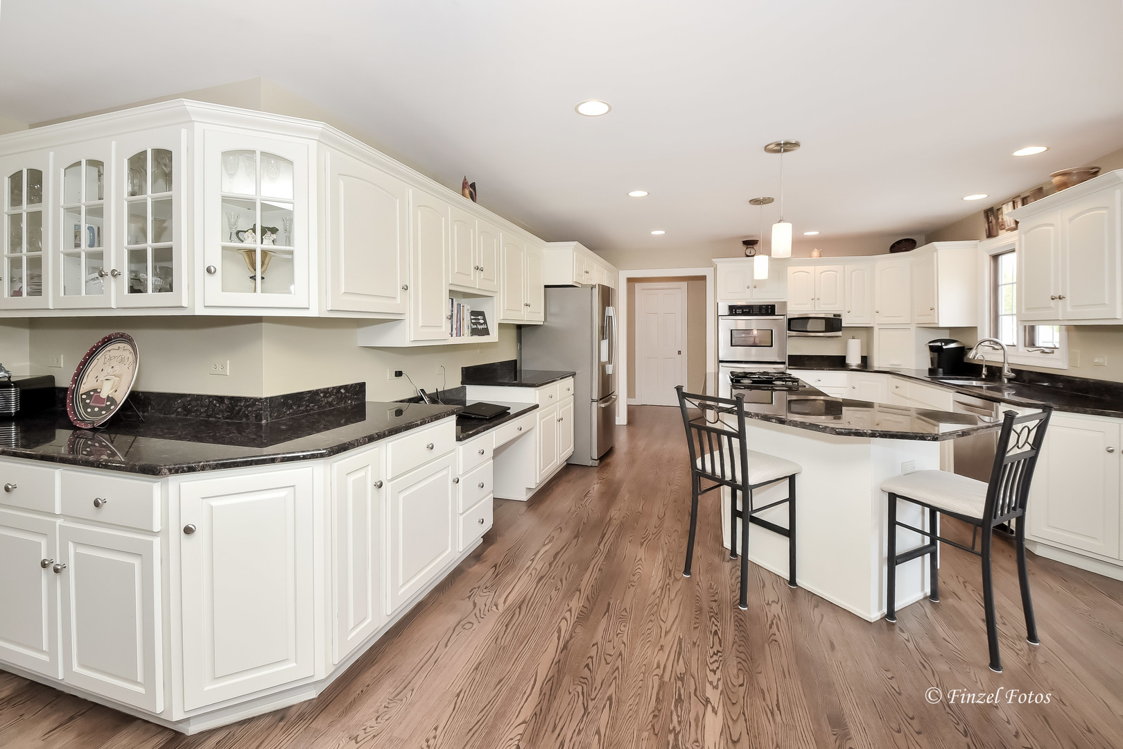 7N355 Ridge Line Road St. Charles, IL 60175 - Photo 6 of 38 a kitchen with granite countertop a sink a counter top space stainless steel appliances and cabinets