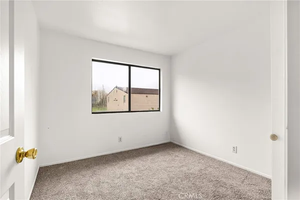 a bathroom with a granite countertop toilet a sink and a bathtub