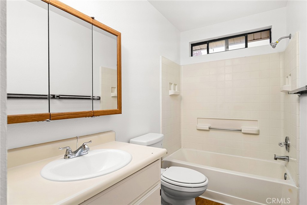 585 North Street Corning, CA 96021 - Photo 16 of 41 a bathroom with a sink toilet and shower
