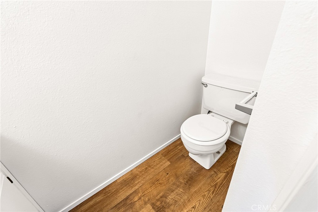 585 North Street Corning, CA 96021 - Photo 22 of 41 a bathroom with a toilet and a rug